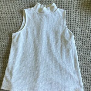 Sleeveless mock neck Loft blouse.